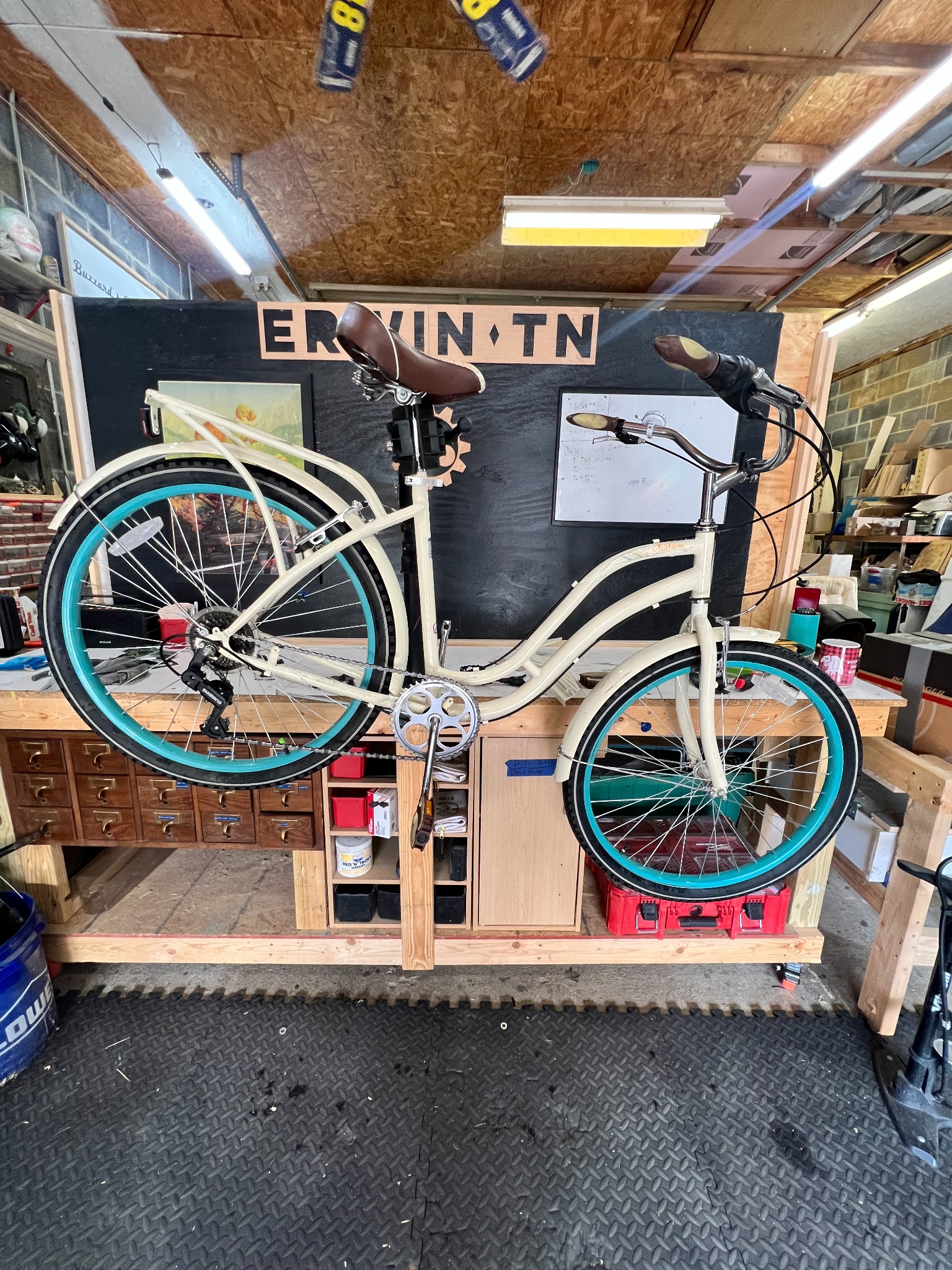 White bicycle displayed inside Winfield’s Bike Shop