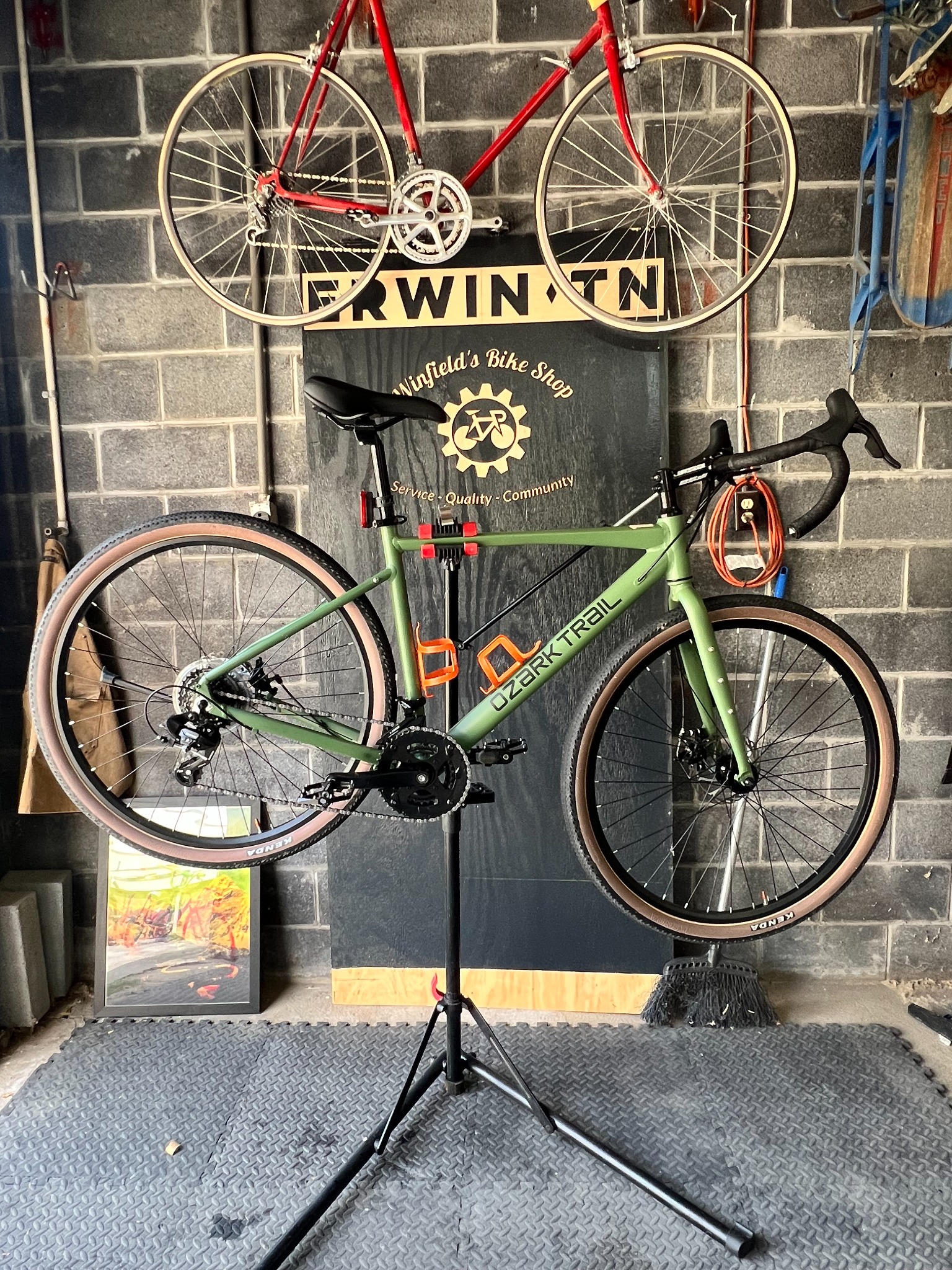 Bicycle on a repair stand inside Winfield’s Bike Shop